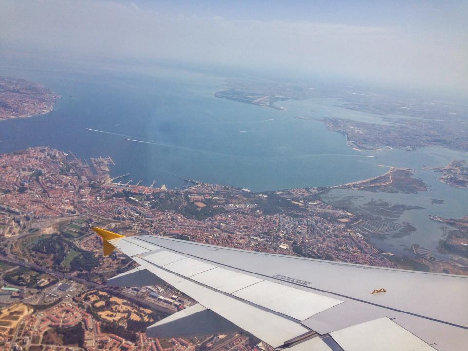 plane window view over lisbon