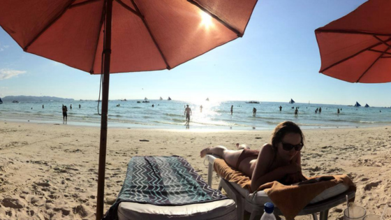 reading on the beach at sunset